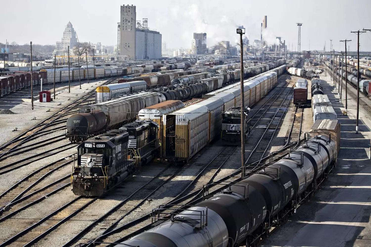 The Heart of Logistics: A Giant US Freight Rail Depot Inside a modern freight rail depot in the USA: maintenance and repair of powerful locomotives for companies like BNSF, Union Pacific, or CSX