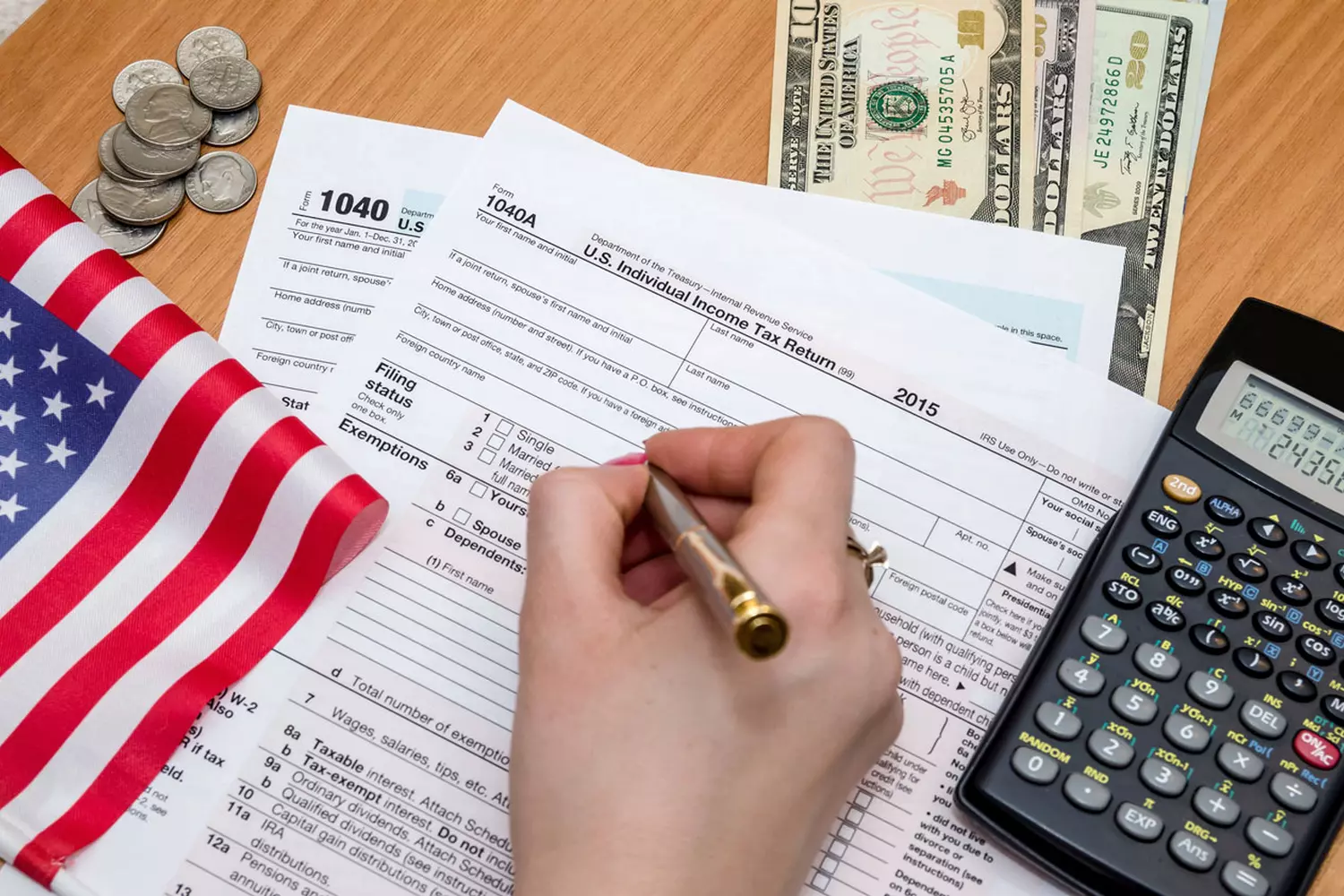 How to pay taxes in the USA — photo of a tax return and a calculator