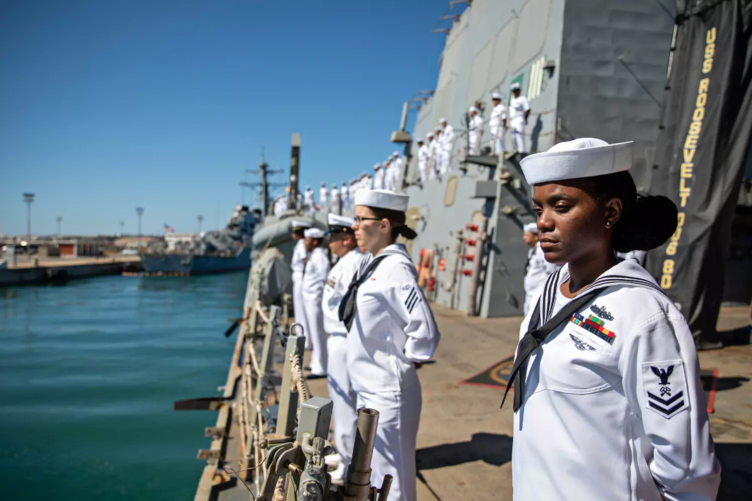 Breaking the Waves: Female Officers in the Modern U.S. Navy A Group of Female U.S. Navy Officers on the Bridge of a Modern Destroyer Discussing Operational Tasks
