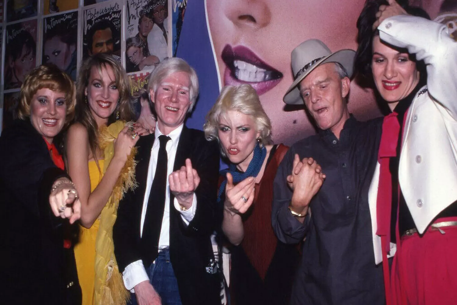 Andy Warhol at Studio 54: The Pop Art King and His Entourage in Disco's Golden Era Andy Warhol surrounded by celebrities and friends at New York's legendary Studio 54 nightclub in the late 1970s, capturing the artist at the epicenter of disco culture with his signature camera documenting the scene