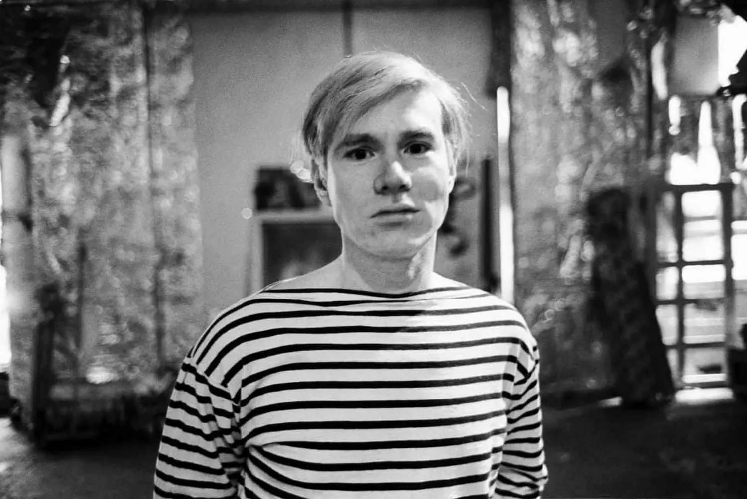 Young Andy Warhol: The Artist Before the Fame A rare photo of a young Andy Warhol in his early artistic days, showing the future pop art icon before he adopted his signature silver wig and became a cultural phenomenon