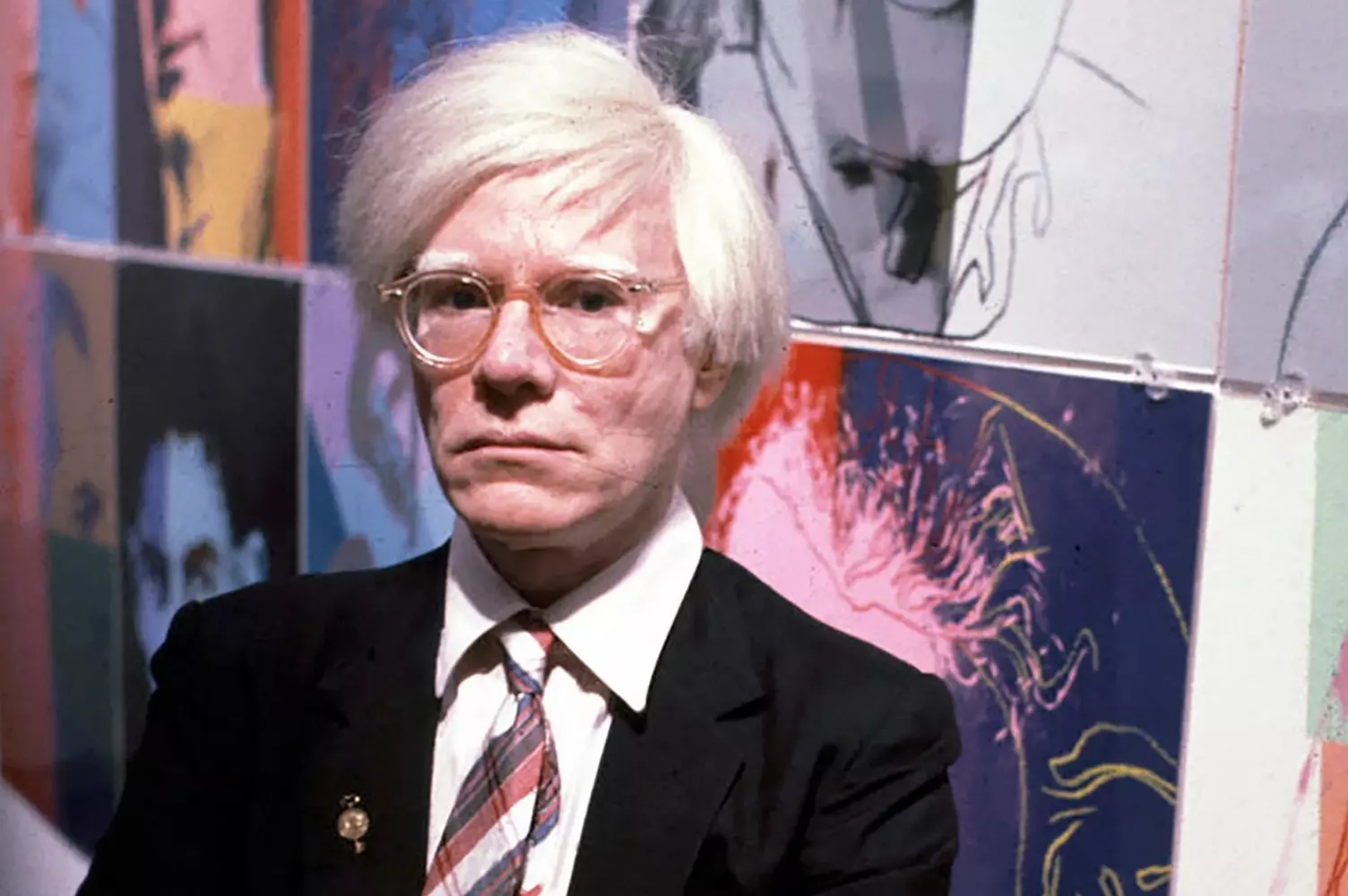 Andy Warhol: The Man Behind the Pop Art Revolution Portrait of Andy Warhol with his signature silver wig and sunglasses, the iconic artist gazes thoughtfully, embodying the spirit of 20th century pop art movement he pioneered