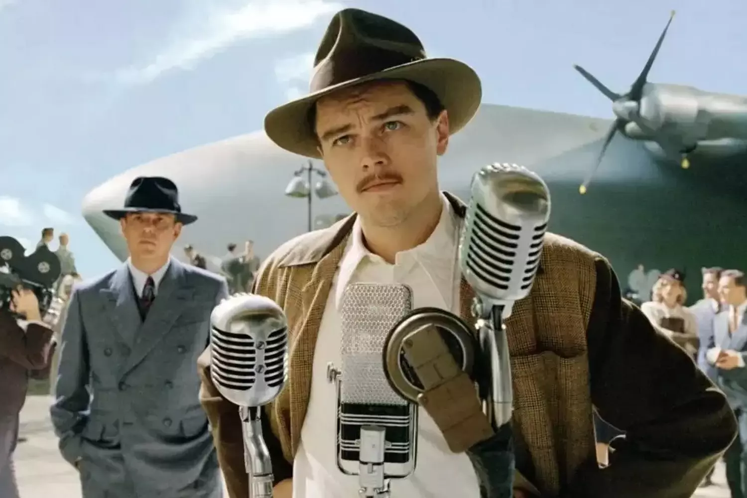 Leonardo DiCaprio Transforms into Howard Hughes in 'The Aviator' Leonardo DiCaprio as Howard Hughes in a scene from Martin Scorsese's 2004 biographical film 'The Aviator', perfectly capturing the eccentric billionaire's intense personality and mannerisms