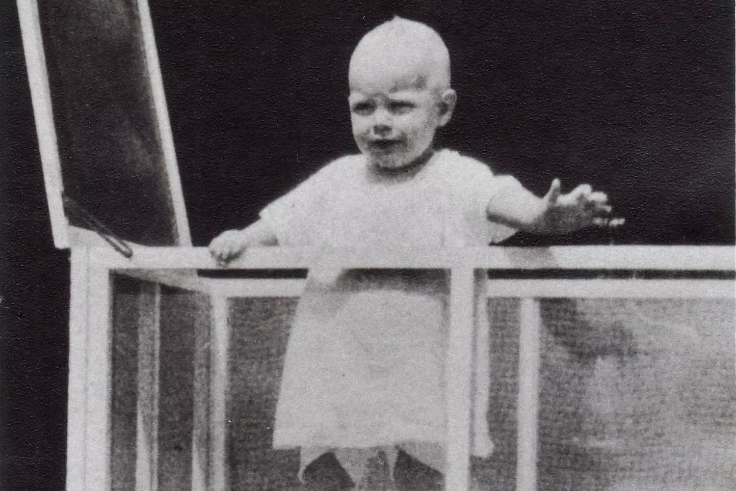 Baby Howard Hughes: The Early Years of an Aviation Legend Rare vintage photo of infant Howard Hughes, future billionaire aviator and film mogul, in his family's arms — the first glimpse of a genius who would change history