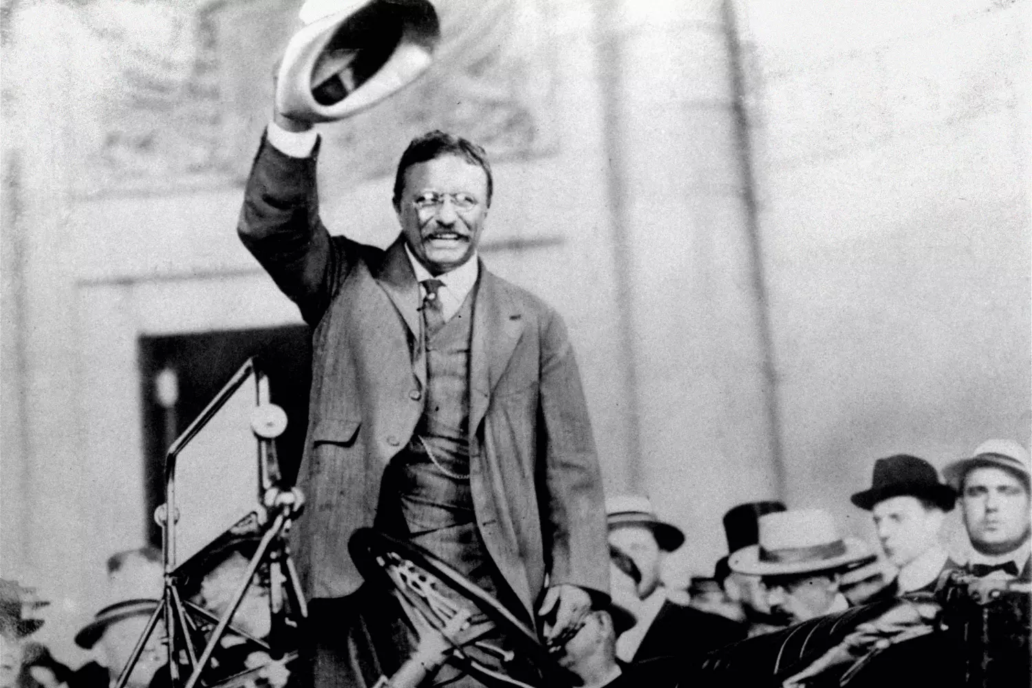 Theodore Roosevelt’s Fiery Speech | The Charismatic Leader Addressing the Crowd Theodore Roosevelt passionately delivers a speech to a large audience, gesturing emphatically