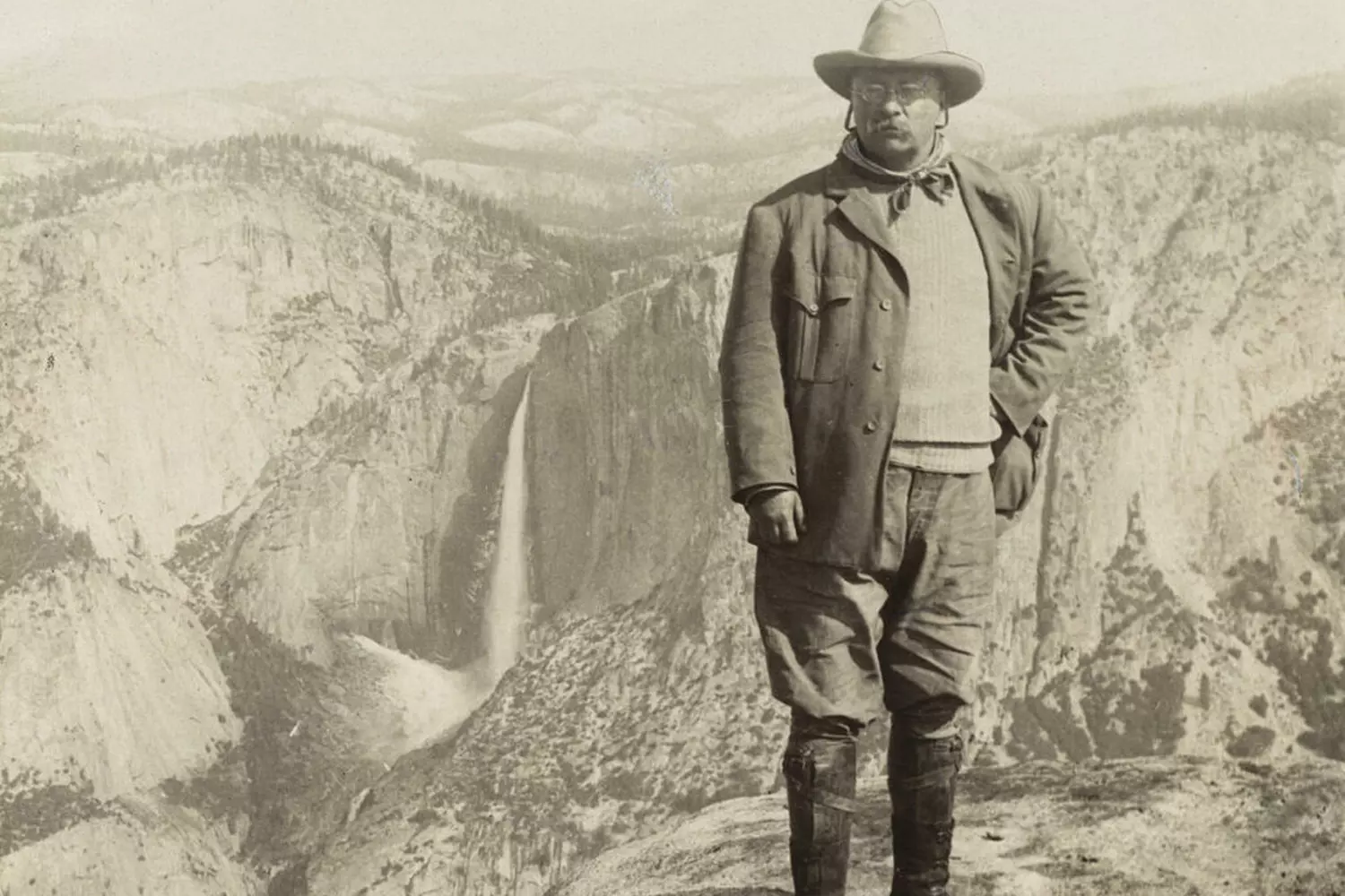 Theodore Roosevelt Against Mountain Backdrop: The Naturalist President in His Element Theodore Roosevelt standing on a mountain slope in hiking attire, admiring a scenic mountain vista