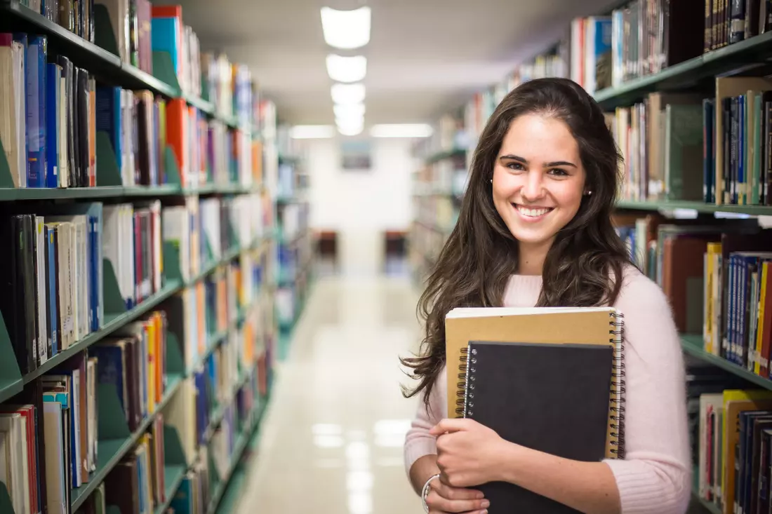 Universities in Florida — photo of a student in the library — American Butler