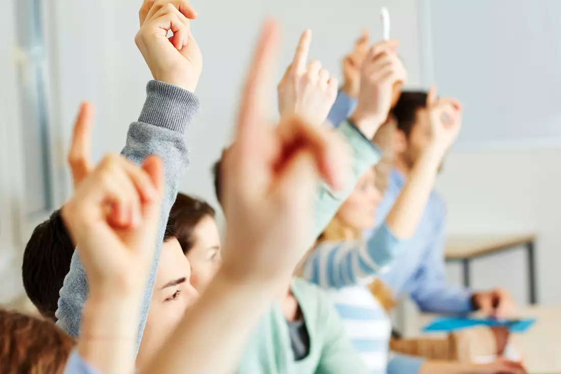 The cost of higher education in the USA — photo of students at a seminar in the classroom — American Butler