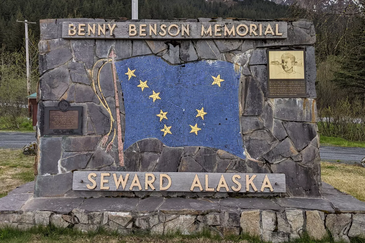 Benny Benson Monument: Honoring Alaska's Young Flag Designer The Benny Benson Memorial in Seward, Alaska, featuring a bronze statue of the teenage designer of Alaska's state flag, with the iconic blue and gold flag waving proudly in the background
