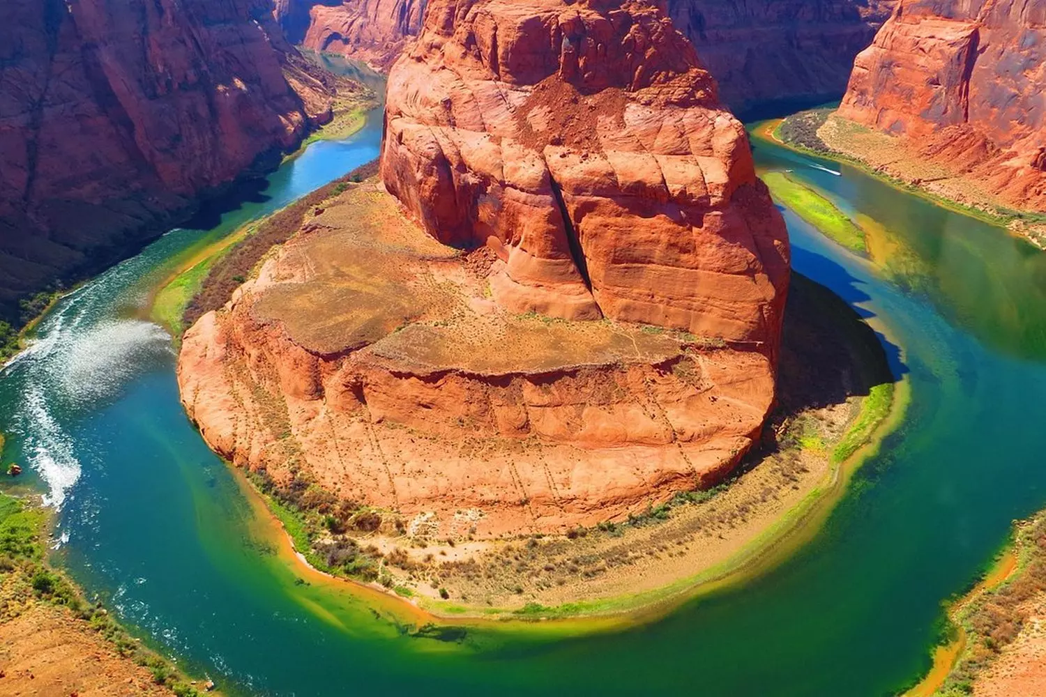 Colorado Horseshoe Bend, Arizona: The Perfect Curve of the River in the Rocks Aerial view of Horseshoe Bend, where the Colorado River makes a dramatic 270-degree turn among red sandstone cliffs near Page, Arizona