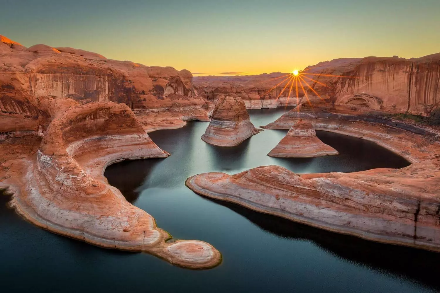 Lake Powell, Arizona: A Turquoise Oasis Amidst Red Canyons Aerial view of the turquoise waters of Lake Powell winding through the red sandstone canyons