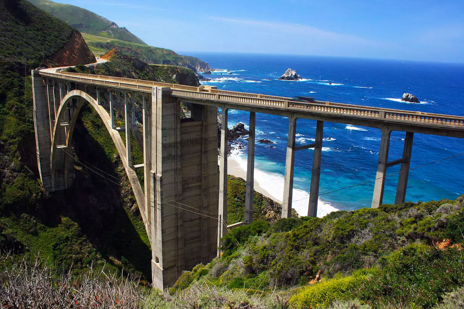 Famous Bixby Creek Bridge on Highway 1 in Big Sur, California, during the day with the Pacific Ocean in the background