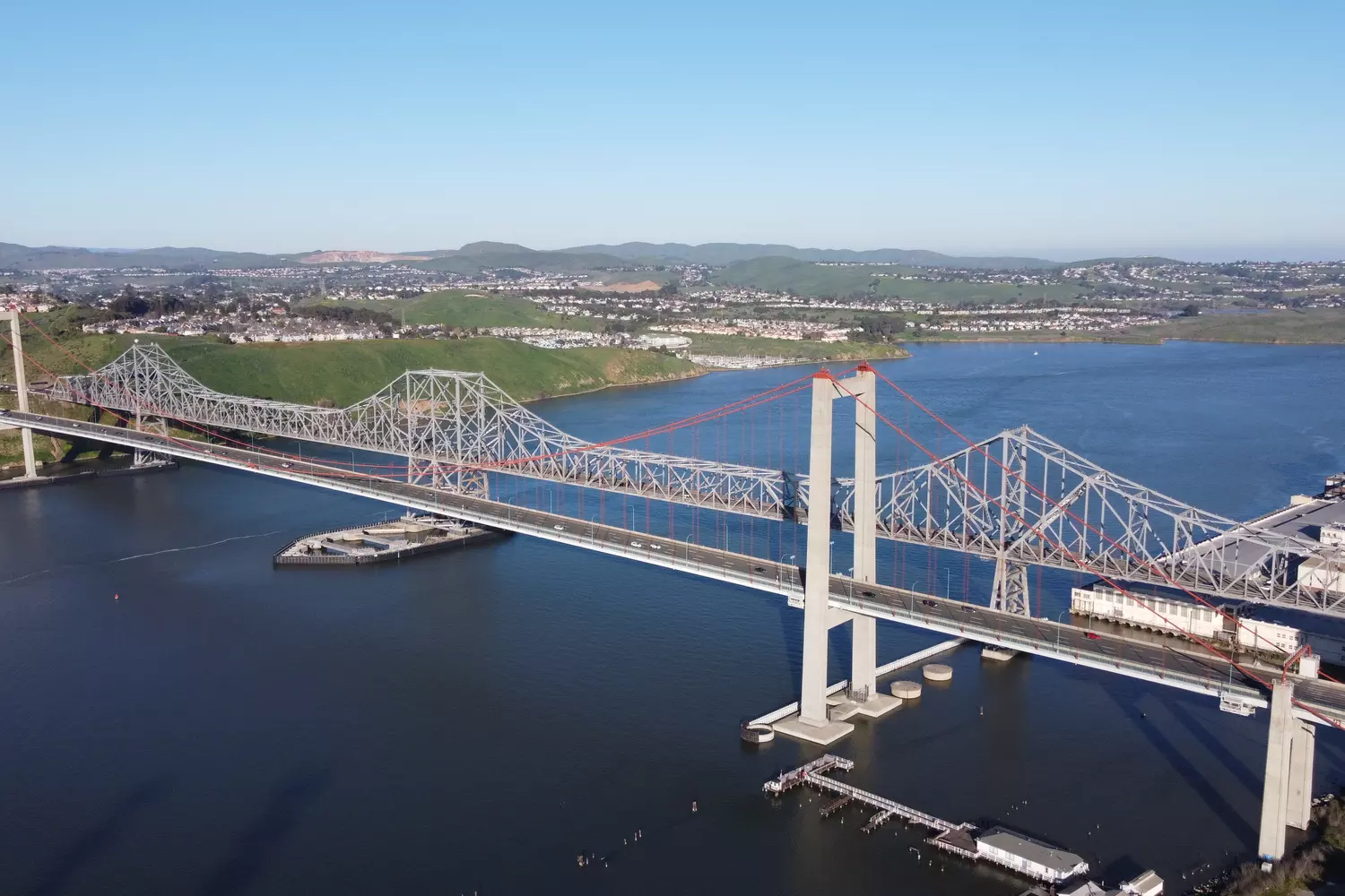Panorama of the Carquinez Bridges over the Carquinez Strait, California, during the day with hills and water views