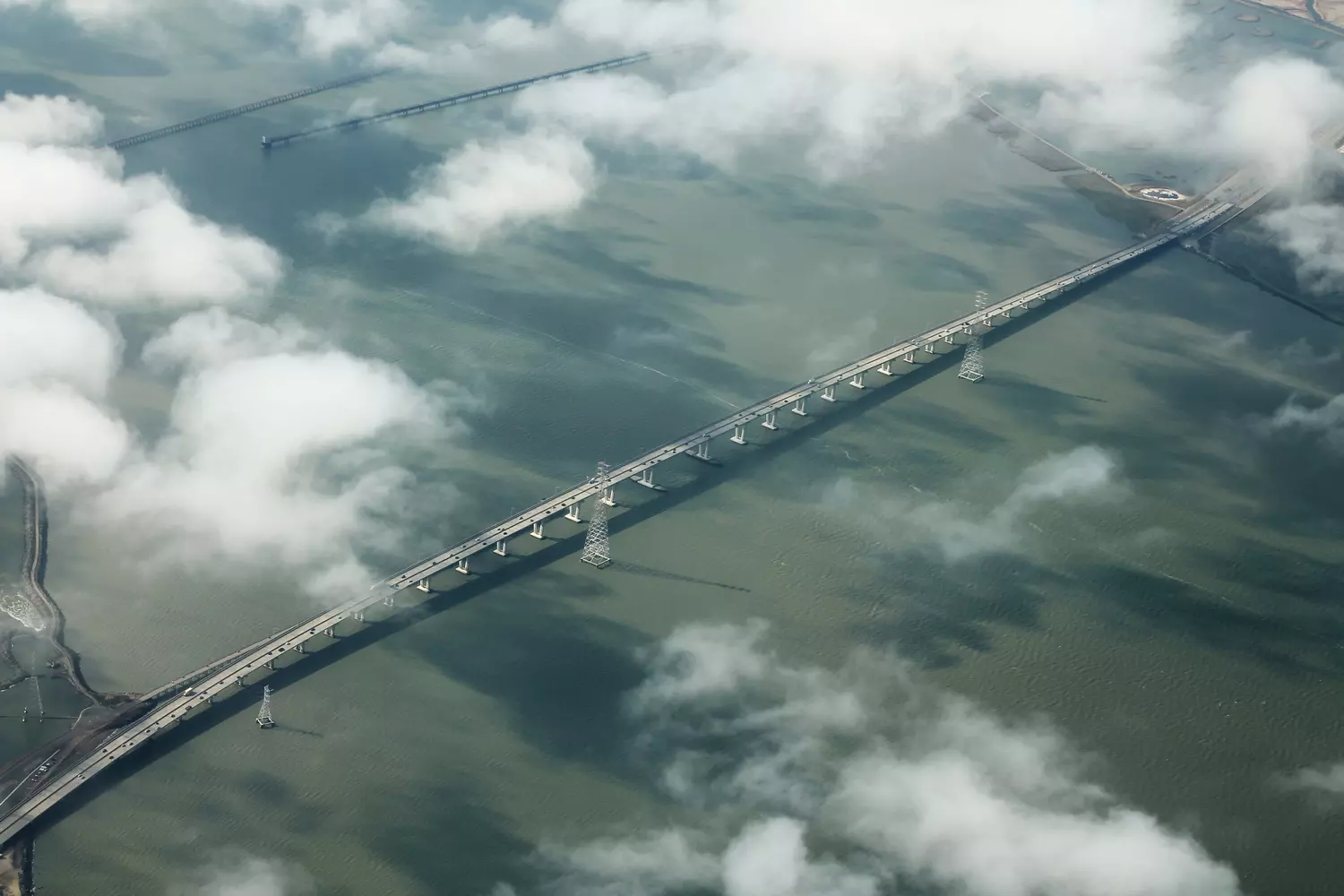 Dumbarton Bridge across San Francisco Bay in California during the day, view of State Route 84 and the water