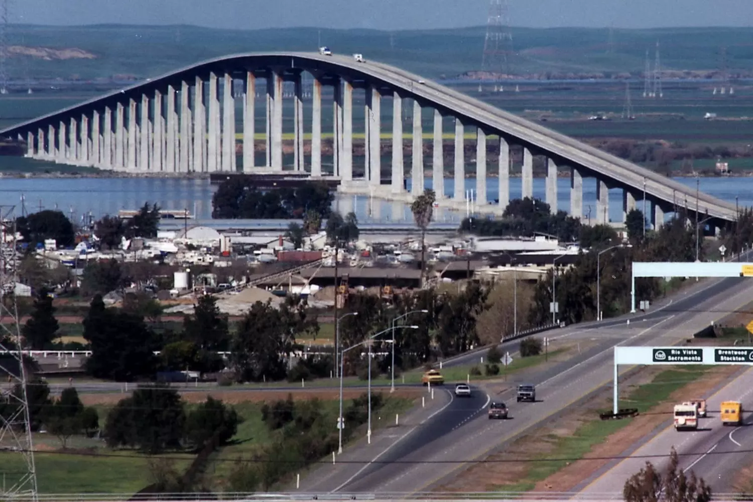 Antioch Bridge over the San Joaquin River in California during the day, view of steel girders and water