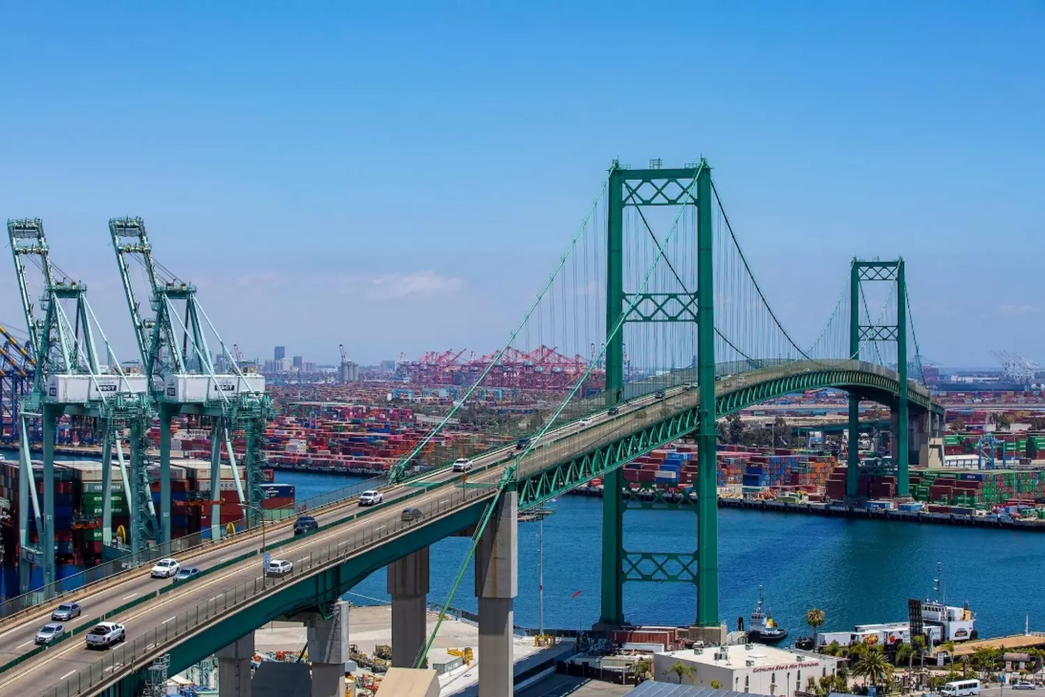Vibrant green Vincent Thomas Bridge in Los Angeles during the day, view of the bay and San Pedro port