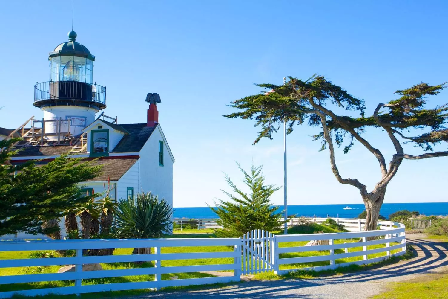 Point Pinos Lighthouse in Cape Cod style — keeper's house attached to the tower, typical New England lighthouse architecture transplanted to the West Coast