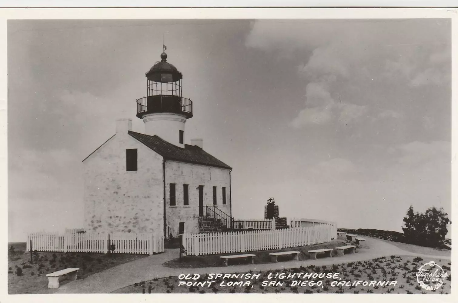 Historic black and white photo of an old lighthouse in San Diego, California