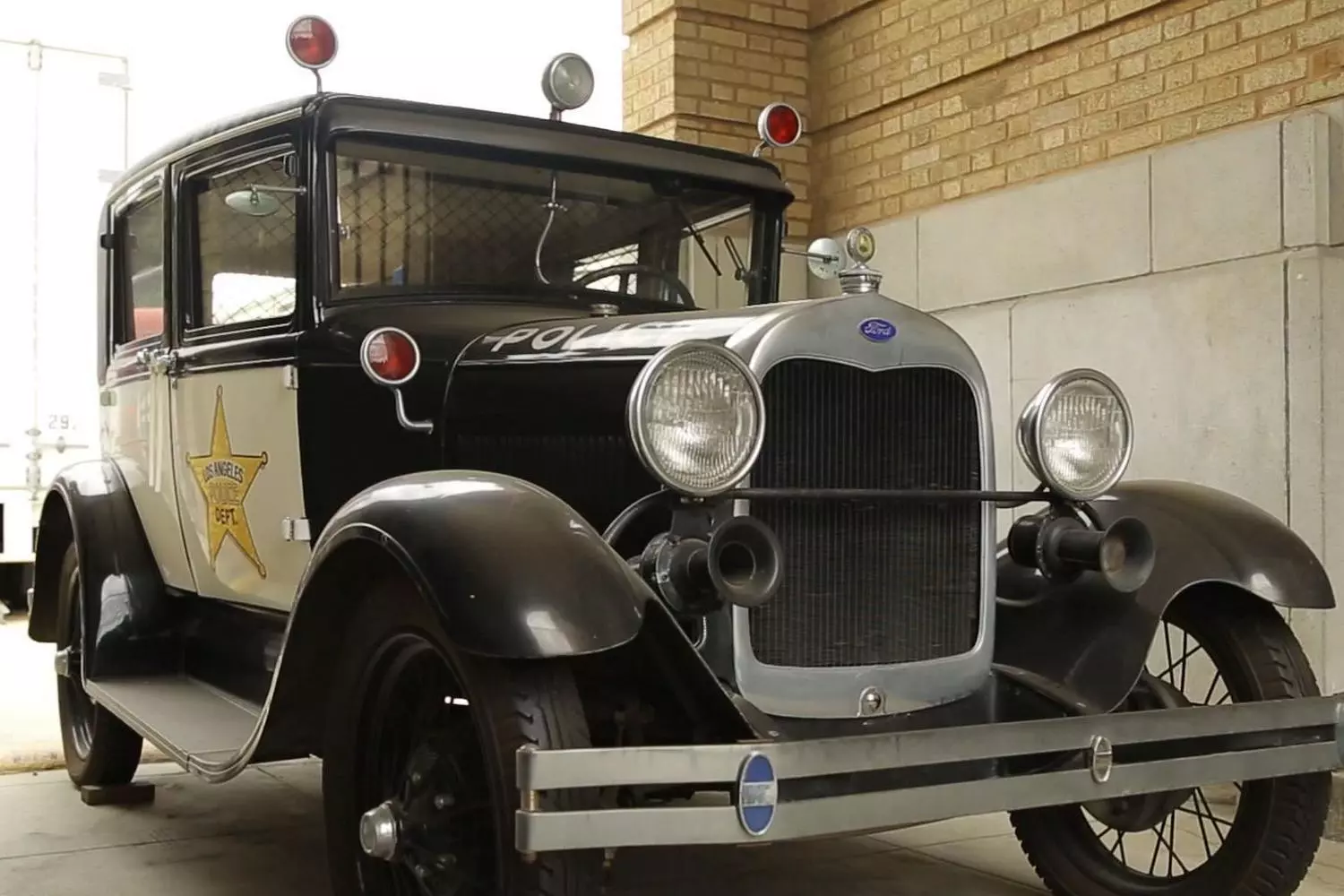 Vintage LAPD police cruiser on outdoor display at the Los Angeles Police Museum