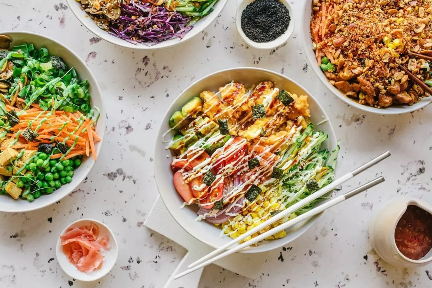 Authentic Hawaiian Poke Bowl with Fresh Ahi Tuna and Rice A colorful and fresh Hawaiian poke bowl in a wooden dish, featuring cubed raw ahi tuna, white rice, sliced avocado, edamame, green onions, and sesame seeds