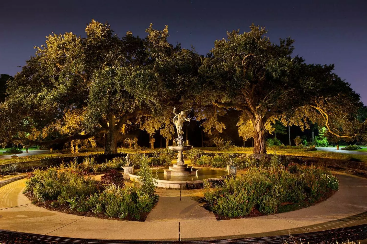 Historic Gumbel Memorial Fountain with a bronze sculpture at the entrance to Audubon Park in New Orleans