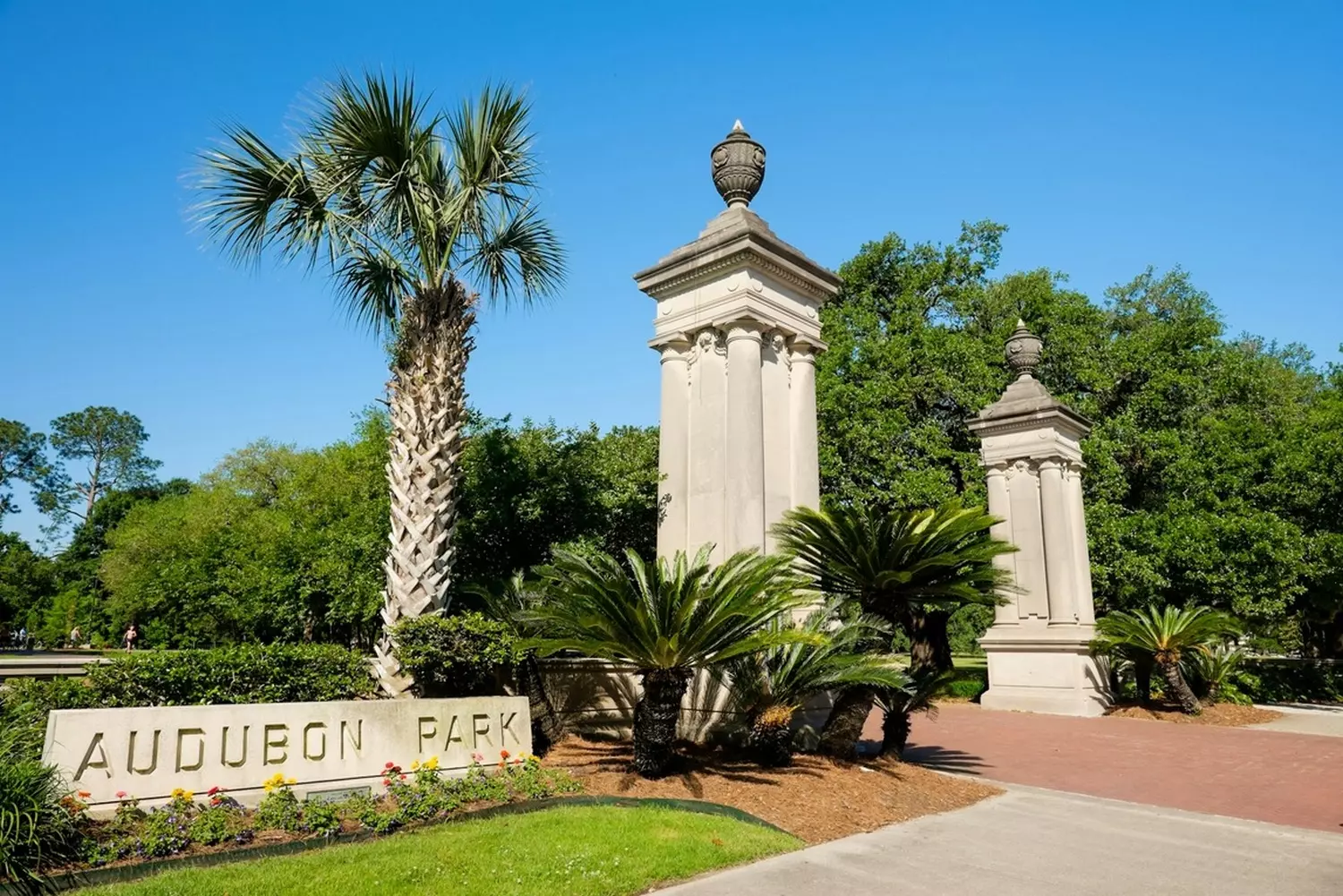 Audubon Park entrance with historic cast-iron gates and century-old oak trees in New Orleans