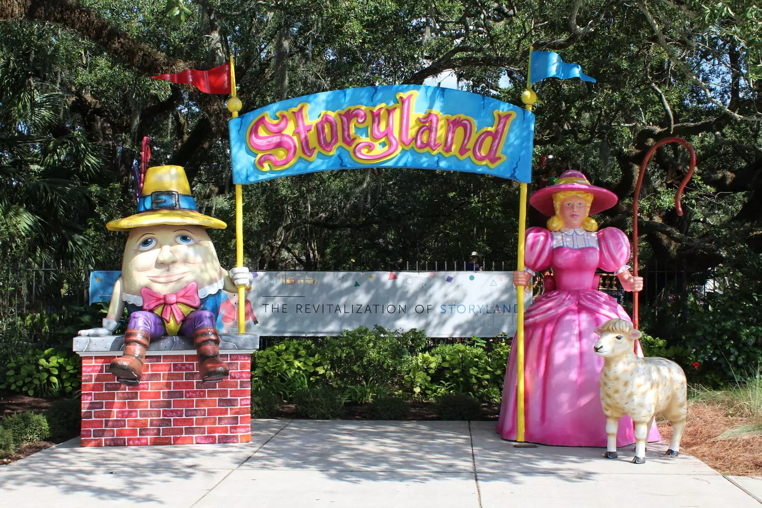 Storyland fairy tale park in New Orleans City Park, fiberglass storybook character sculptures under centuries-old live oaks draped in Spanish moss