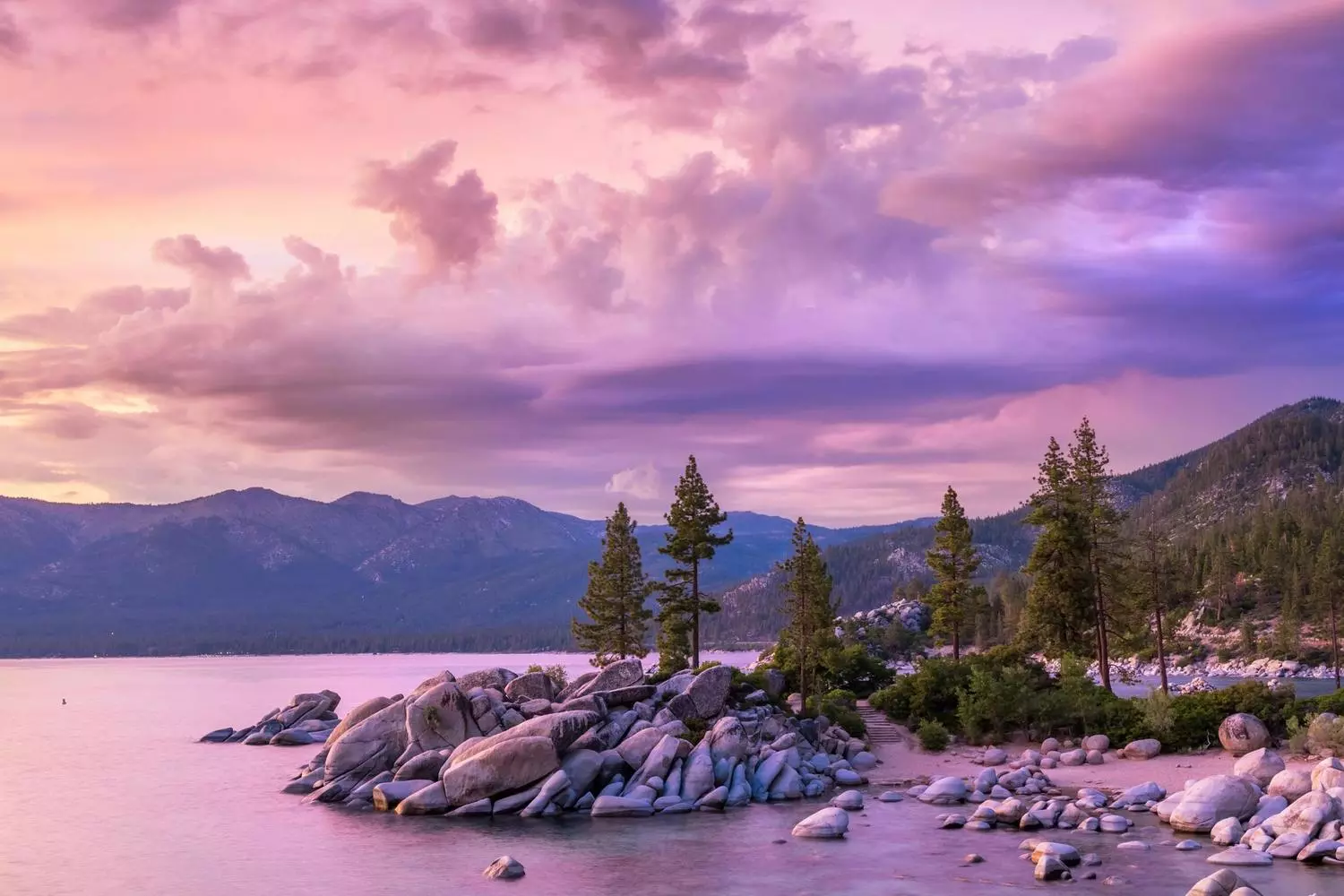 Peaceful sunset over Lake Tahoe with reflections on the water Lake Tahoe at sunset with colorful sky and calm water
