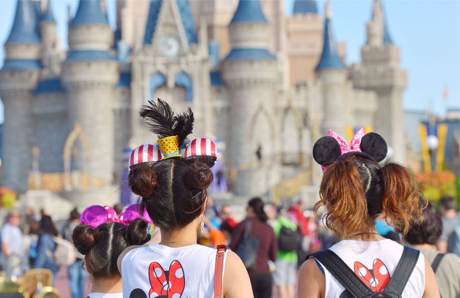 Photo of two girls in T-shirts with Mickey Mouse in Magic Kingdom Orlando