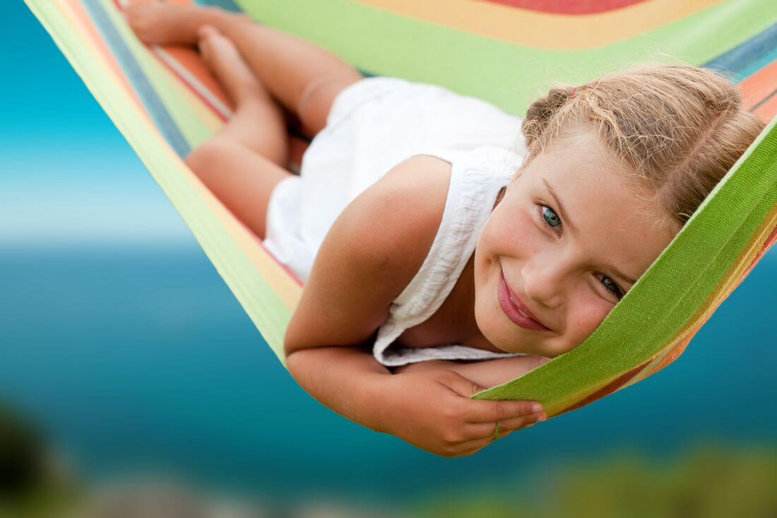 Kindergartens in Miami — photo of a beautiful girl in a hammock — American Butler