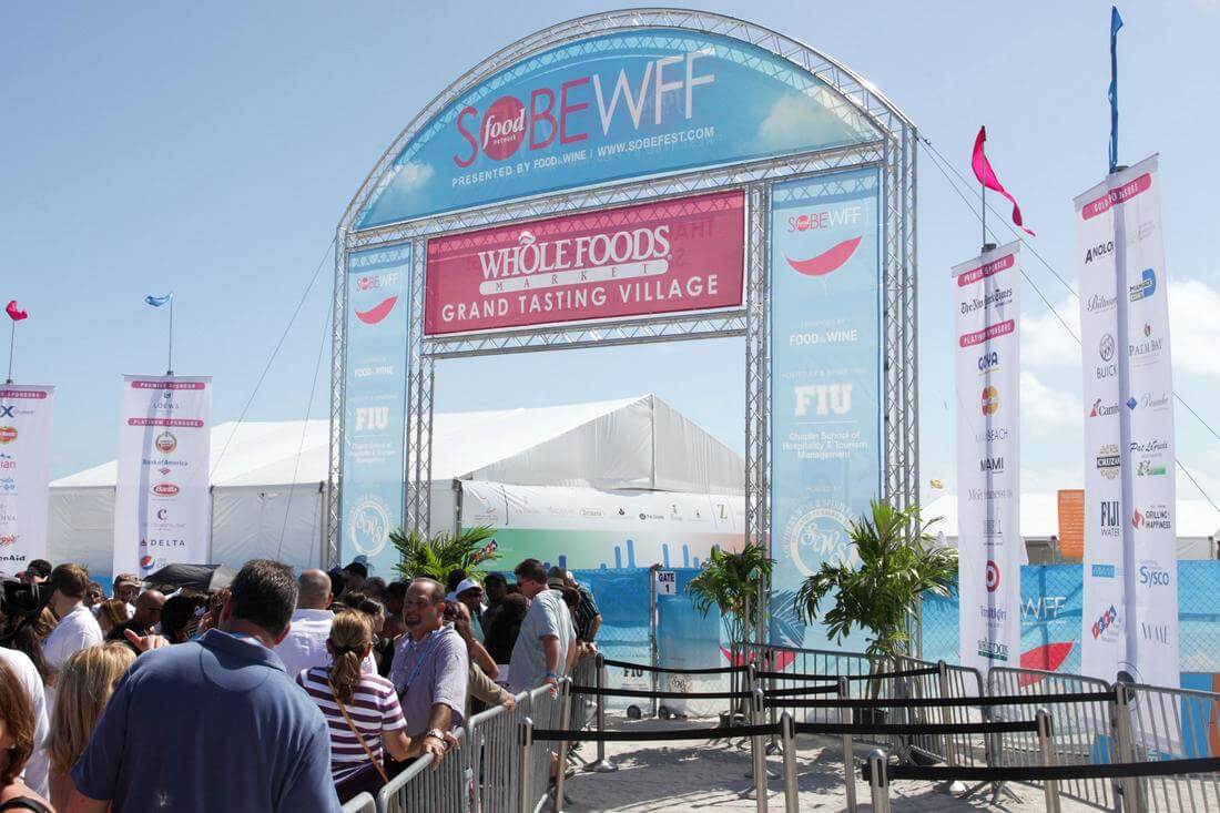 Photo of the entrance to a tasting village at the South Beach Food and Wine Festival — American Butler