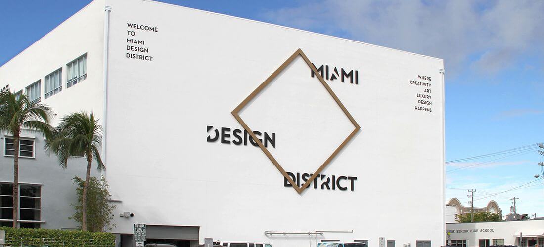 Photo of a sign at the entrance of the Miami Design District — American Butler