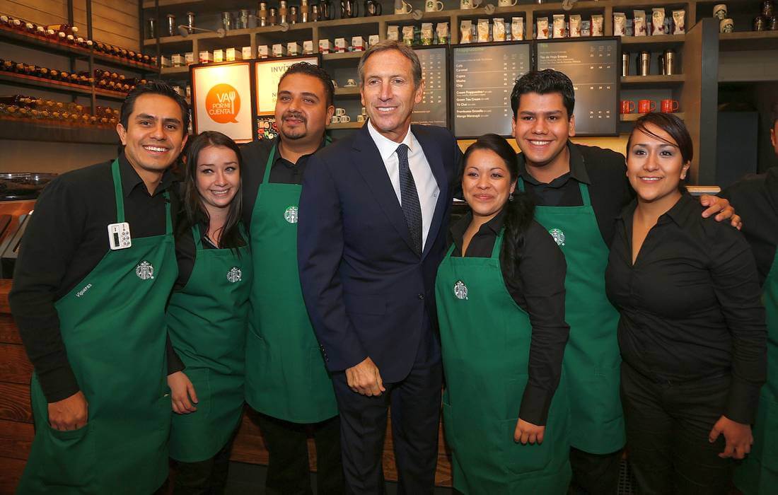 Starbucks Empire President Howard Schulz with the staff of one of the coffee houses - American Butler