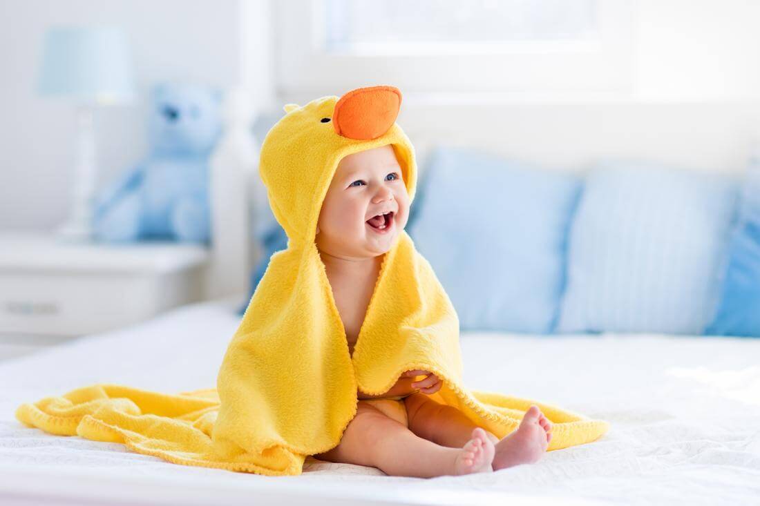 American smile and its secrets — photo of a baby with a smile and a duck costume — American Butler